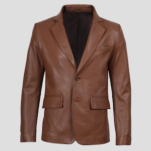 May include: A brown leather blazer with a notched lapel, two front pockets, and a single-button closure. The jacket has a classic, tailored design, suitable for various occasions. The blazer is a medium brown color.