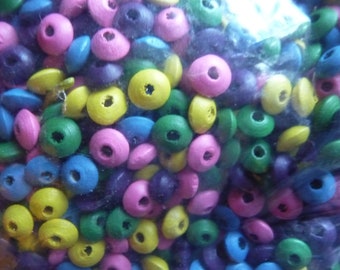 Bead mix, wood, mixed colors, 8x4mm rondelle. Sold per 90-gram pkg, approximately 1,200 beads.