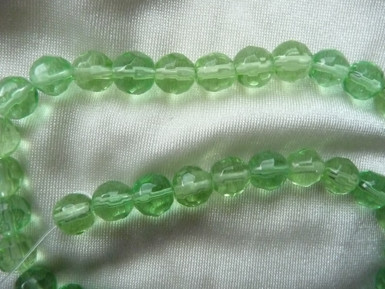 SALE! SALE!! Bead Sold per 12-inch strand glass spring green 7-8mm faceted round