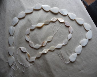 2 Strands of Mother of Pearl, Natural Bleached/White, 1 is a 18x10mm Flat Diamond and 1 is 22x15mm Flat Teardrop. Sold per 15-inch strands.