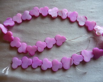 Beads, Mother of Pearl, 15mm Trifold, Hot Pink.  Sold per 16 inch strand. There are 30 beads on the strand.