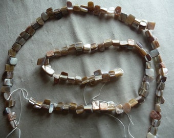 2 Strands of Mother of Pearl 10x5-8x4-6x5mm mini nuggets, Shades of brown/tan. Sold per 15-inch strands.