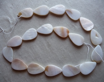 Beads, Mother of Pearl, 24x15mm Flat Teardrop, Natural Bleached/White.  Sold per 16 inch strand.  There are 18 beads on the strand.