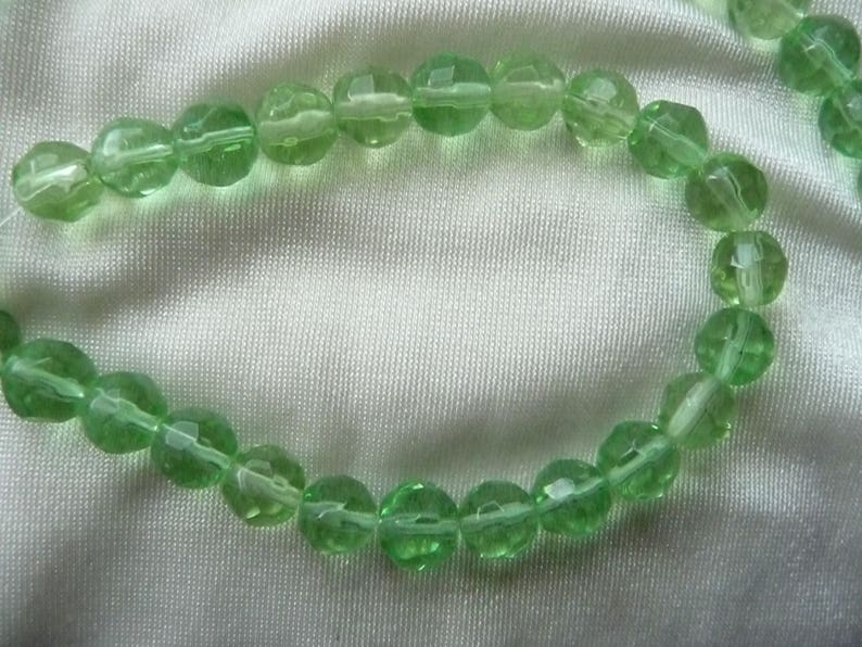 SALE! SALE!! Bead Sold per 12-inch strand glass spring green 7-8mm faceted round