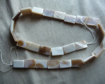 Beads, Mother of Pearl, 15x10 Flat Rectangle, White/Natural Bleached. Sold per 15-inch strand. There are 26 beads on the strand.