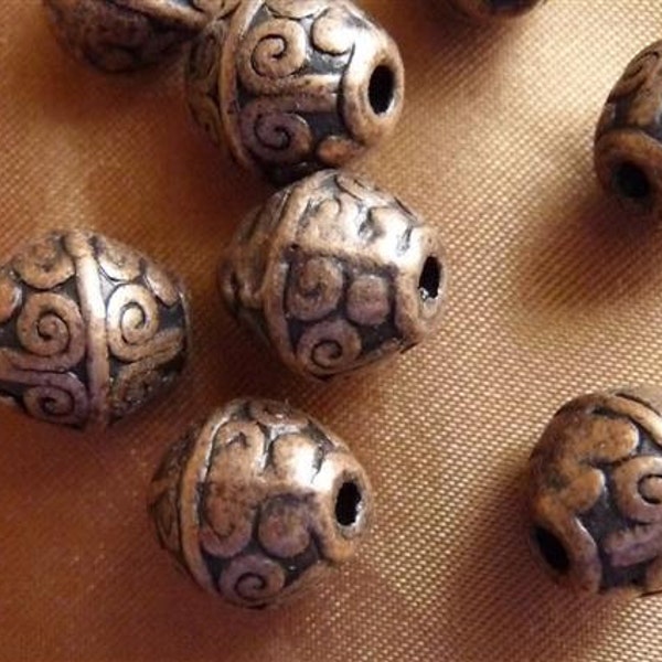 Beads, antique copper-plated pewter, 12x11mm bicone. Pack Of 10 beads.