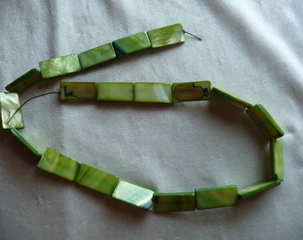 Beads, Mother of Pearl, 20x10mm Flat rectangle, Shades of Green. Sold per 16-inch strand. There are 20 beads on the strand.