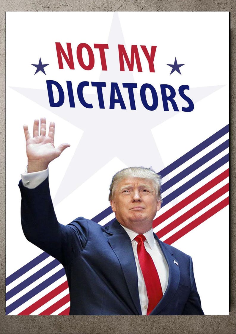 May include: Poster with the words "NOT MY DICTATORS" in red and blue, with a star graphic. The image shows a man in a blue suit and red tie, raising his hand in a wave.