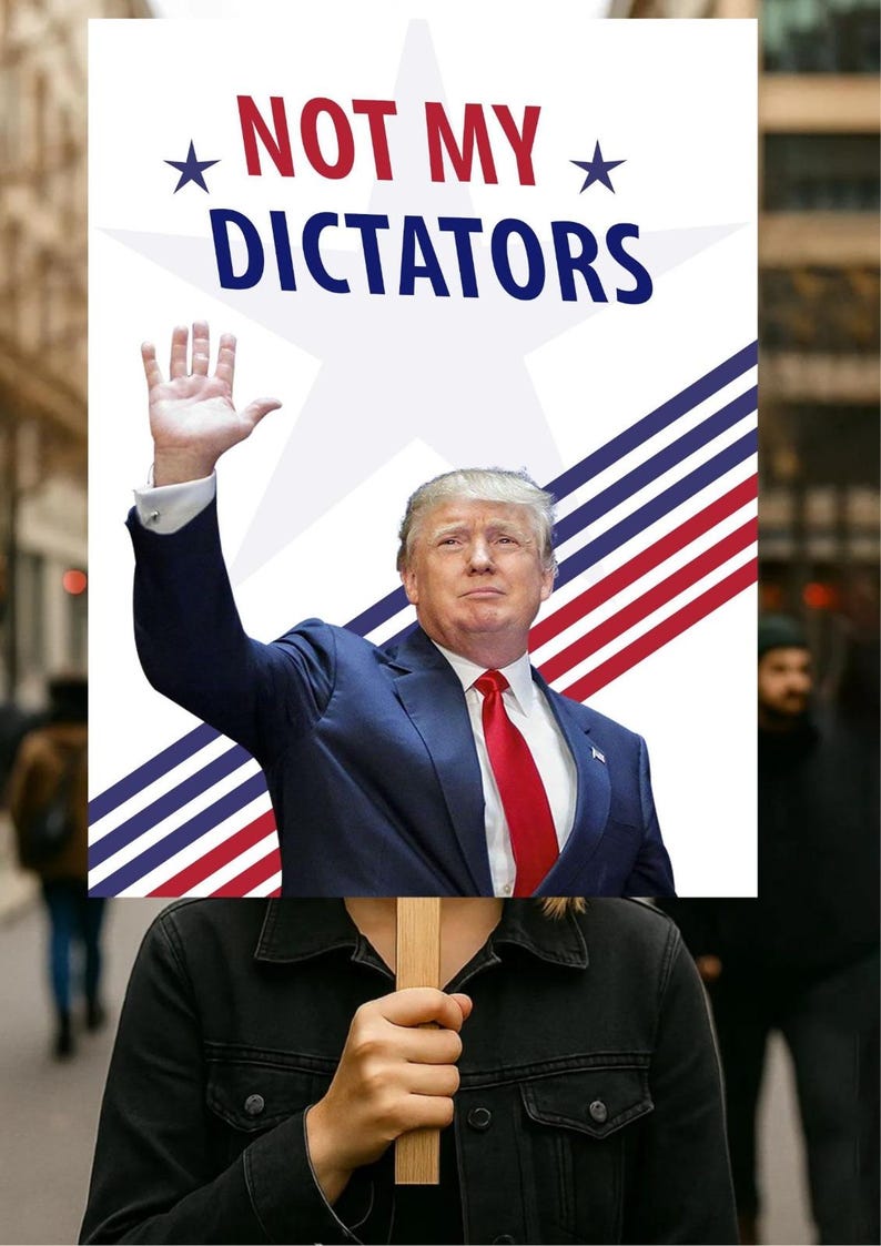 May include: A protest sign with the words "NOT MY DICTATORS" in red and blue. The sign features an image of a man in a suit and red tie, with his right hand raised. The sign is held by a person in a black jacket.