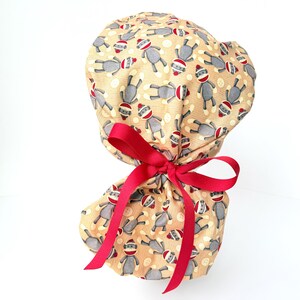 Sock Monkey PonyTail Surgical Scrub Cap: Womens. Scrub hat