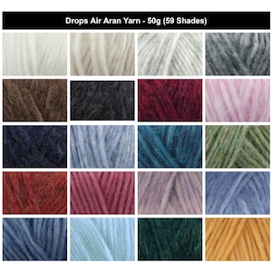 Pode incluir: Uma grade de vinte amostras quadradas exibindo o fio Drops Air Aran em várias cores, incluindo branco, cinza, preto, vermelho, rosa, azul, verde e amarelo. O texto no topo diz Drops Air Aran Yarn - 50g (59 Shades).