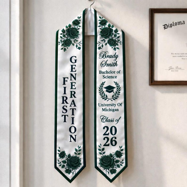 A graduation gown with the text "GENERATION" and "Brady Smith Bachelors of Science" printed on it, hanging on a wall.