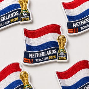 May include: Embroidered patches featuring the Netherlands flag in red, white, and blue. Each patch includes the text "NETHERLANDS WORLD CUP 2026" and a golden trophy with a soccer ball, indicating the World Cup.