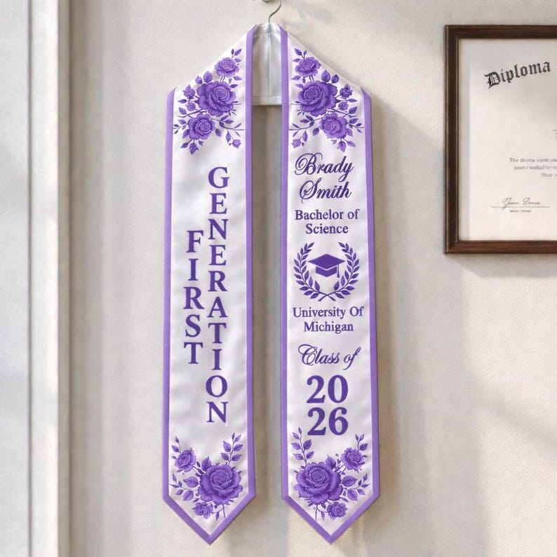 A purple graduation cap and gown with the text "Brady Smith" and "Bachelor of Science" printed on it, hanging on a wall.