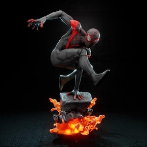 May include: A black and red action figure of Spider-Man in a dynamic pose, standing on a rock base with orange flames erupting from the bottom.