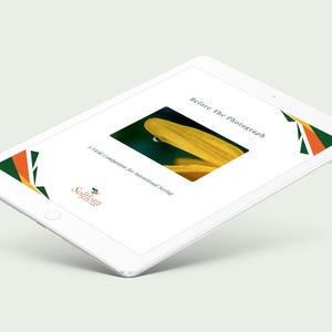 May include: A white tablet displays a book cover with the title "Before The Photograph" and a close-up of a yellow flower petal with a water droplet. The tablet also features the "Solflora" logo and geometric designs.