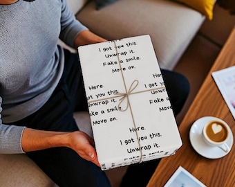 May include: A wrapped gift with the text "I got you this. Unwrap it. Fake a smile. Move on." The gift is tied with twine and held by a person. A cup of coffee with a heart design is on a nearby table.