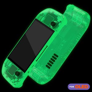 May include: A translucent green gaming console case for the Nintendo Switch OLED model. The case is made of clear plastic and has a design that shows the internal components of the console. The case is designed to protect the console from scratches and dust.