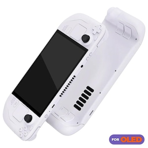 May include: A white handheld gaming console with a black screen and buttons. The console has a  "FOR OLED" label on the bottom right corner.