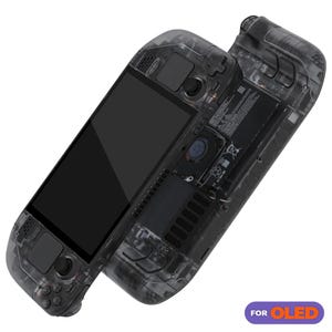 May include: A transparent black handheld gaming console with a clear back panel revealing the internal components. The console has a black screen, buttons, and a joystick. The text "FOR OLED" is printed on the bottom right corner of the image.