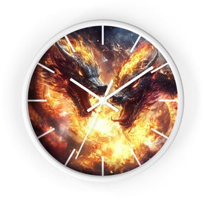 May include: A round wall clock with a white frame. The clock face features a dramatic illustration of two dragons engulfed in flames, with fiery orange and yellow hues. The dragons face each other, with their heads close together. White hands indicate the time.