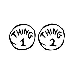 May include: Two circular black and white graphic designs featuring hand-drawn style outlines. The left circle contains the text THING 1, and the right circle contains the text THING 2, both written in bold, uppercase, slightly irregular black lettering.