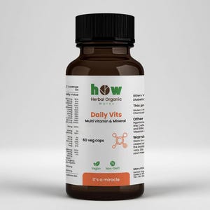 May include: A brown glass bottle with a black cap, labeled "Daily Vits Multi Vitamin & Mineral." The label includes the text "60 veg caps," and "It's a miracle." The bottle contains a supplement.