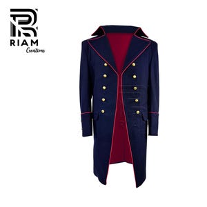 May include: A navy blue coat with a red interior and trim. The coat features gold buttons and a double-breasted design. The coat has long sleeves and a classic, formal style. The logo "RIAM Creations" is in the upper left corner.