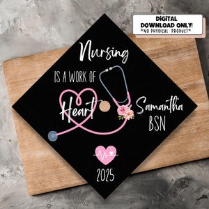 May include: Black graduation cap with the text "Nursing is a work of heart" and a pink stethoscope with a heart shape. The cap also has a pink heart with a heartbeat symbol and the text "Samantha BSN 2025".