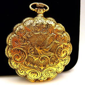Vintage Max Factor Victorian Swallow design ladies compact, pocket watch style, gold tone
