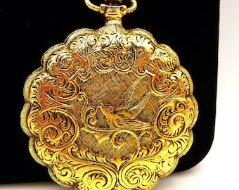 Vintage Max Factor Victorian Swallow design ladies compact, pocket watch style, gold tone, 2 1/4"
