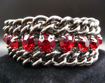 Bold jeweled gunmetal chain bracelet, dragons blood red stones, thick weighty chain, unsigned vintage