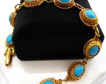 Dainty Persian blue faceted faux turquoise link bracelet, Etruscan Revival cast gold tone frames, unsigned vintage, 7 1/2" L