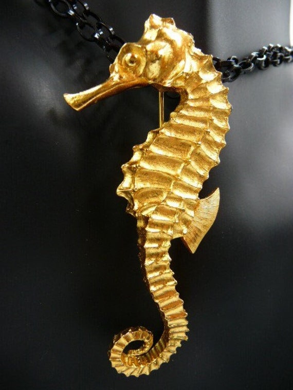 Seahorse gold tone brooch pin, carved metal, unsig