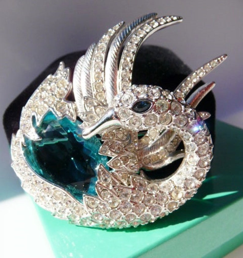 silver tone faux topaz aquamarine sea blue stone Nolan Miller swan brooch pin designer signed vintage