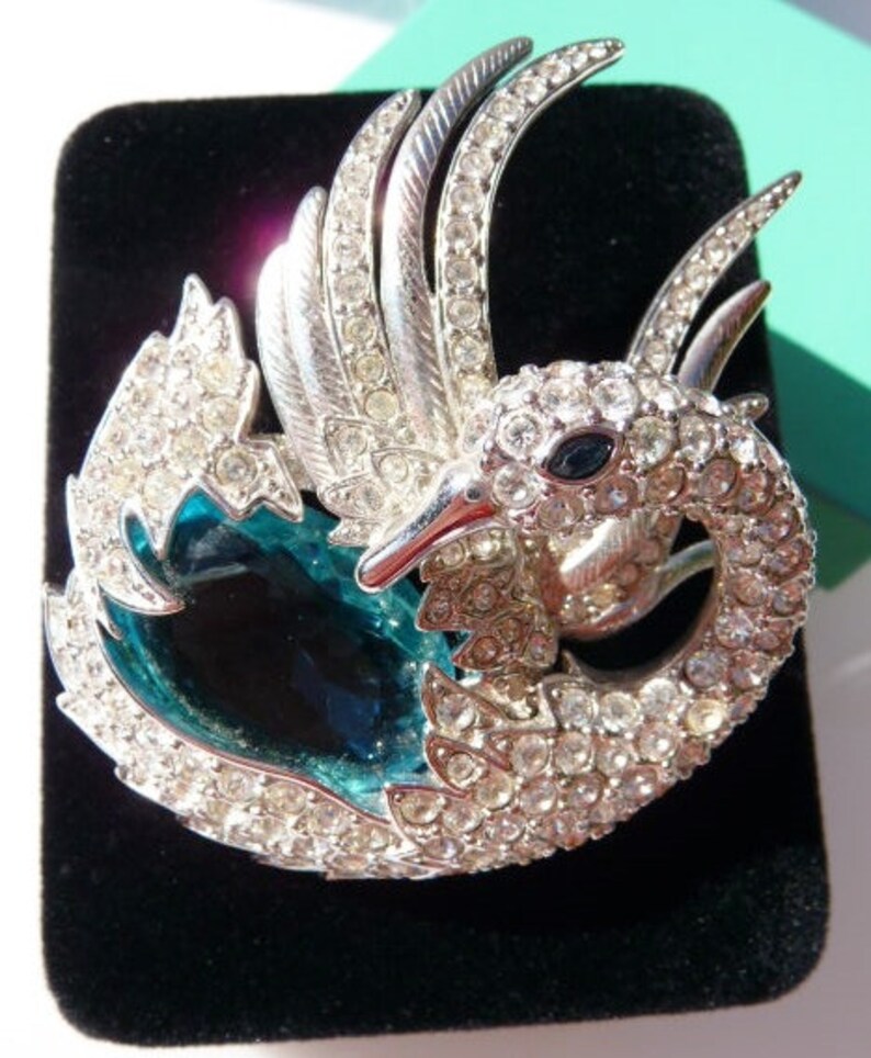 silver tone faux topaz aquamarine sea blue stone Nolan Miller swan brooch pin designer signed vintage