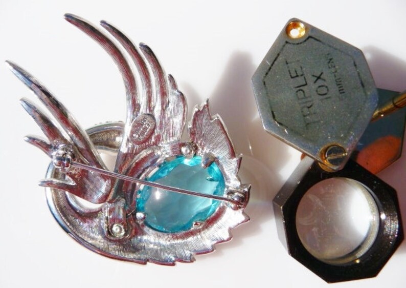 silver tone faux topaz aquamarine sea blue stone Nolan Miller swan brooch pin designer signed vintage