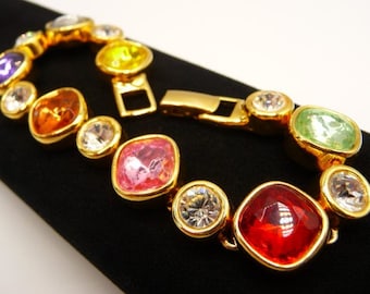 Joan Rivers gold tone statement tennis style gems bracelet, rainbow colors faceted faux gems, pink red yellow, 7 1/2" L