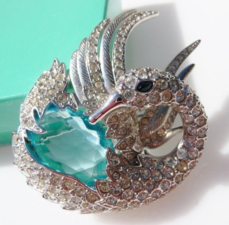 silver tone faux topaz aquamarine sea blue stone Nolan Miller swan brooch pin designer signed vintage