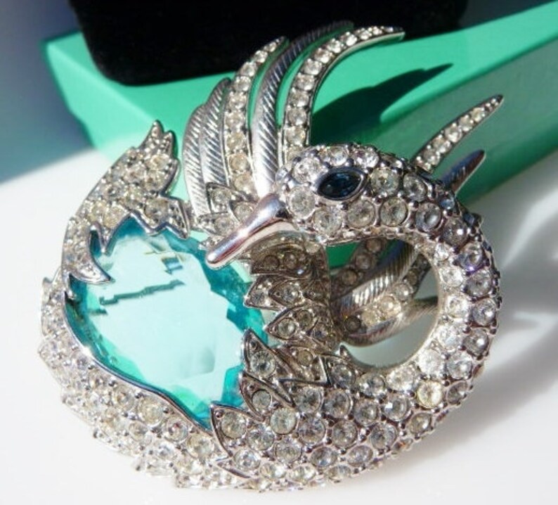 silver tone faux topaz aquamarine sea blue stone Nolan Miller swan brooch pin designer signed vintage