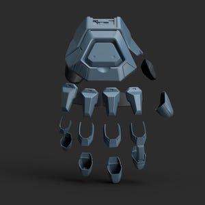 Puede incluir: Una mano robótica desmontada, de color gris. Está compuesta por múltiples componentes geométricos, incluyendo una sección de la palma, segmentos de dedos y elementos de muñeca, todo sobre un fondo oscuro. El diseño tiene una estética futurista.