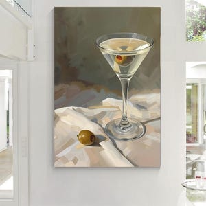 Peut inclure: Peinture d'un martini dans un verre transparent avec une olive verte. Le verre à cocktail est grand et fin, rempli d'un liquide clair. Une olive repose à l'intérieur du verre, et une autre olive est posée sur le tissu blanc.