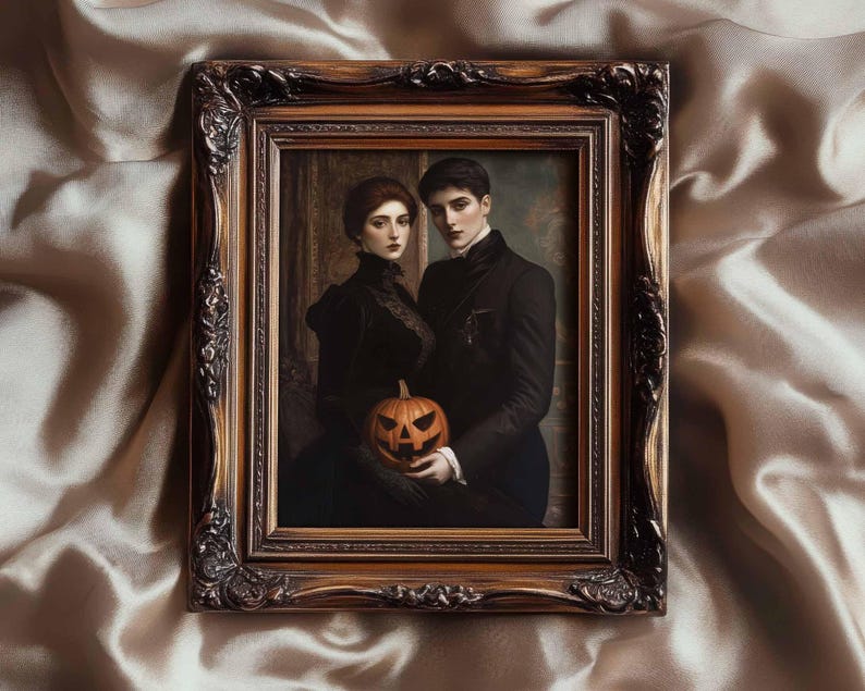 May include: A framed portrait featuring a couple in Victorian attire, holding a carved jack-o'-lantern. The ornate, gold-toned frame surrounds the painting, which has a vintage aesthetic. The couple is dressed in black, with the woman wearing a high-collared dress.