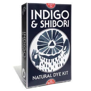 Graham Keegan's Indigo and Shibori Natural Dye Kit sits on a white background. This box, the size of a hardcover novel contains all the ingredients and how-to instructions for you to DIY an Indigo project including fun and easy folding patterns.