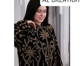 May include: Black velvet robe with gold sequin embellishments in a star and floral pattern. The robe has long sleeves and a high collar. The text "AZ CREATION" is in the upper right corner.