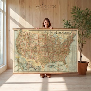 May include: A large vintage-style wall map titled The United States of America, featuring detailed state boundaries, geographical features, and inset maps of Alaska and Hawaii, mounted on a wooden frame with a natural finish and hanging rails.