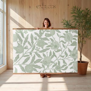 May include: A large rectangular wall art piece with a wooden frame. The artwork features a repeating pattern of green floral and fruit designs on a white background. The word "ENDLESS" is printed at the top.