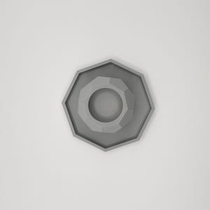 May include: A gray, geometric, octagonal object with a central circular depression. The object has a layered design, with each layer slightly smaller than the one below. The overall shape is symmetrical and modern.