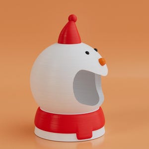 May include: A 3D-rendered snowman ornament. The snowman has a white body, a red hat, and a red scarf-like base. It features black eyes and an orange nose. The background is a solid orange colour.