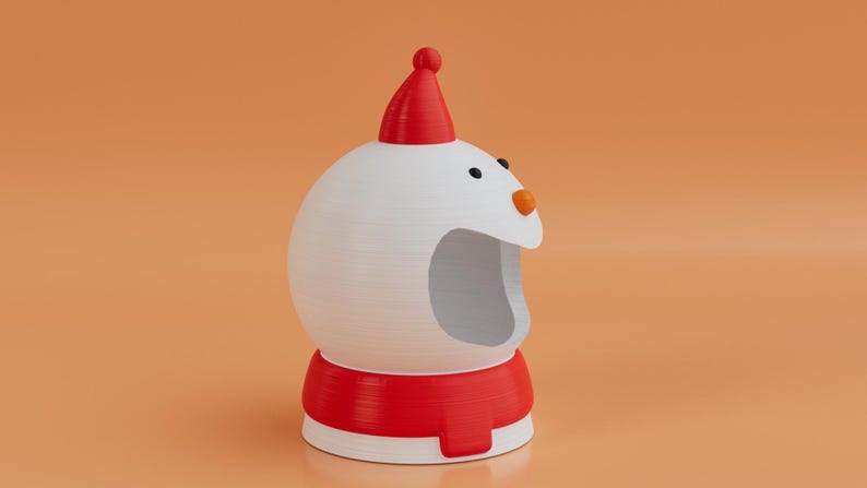 May include: A 3D-rendered snowman ornament. The snowman has a white body, a red hat, and a red scarf-like base. It features black eyes and an orange nose. The background is a solid orange colour.
